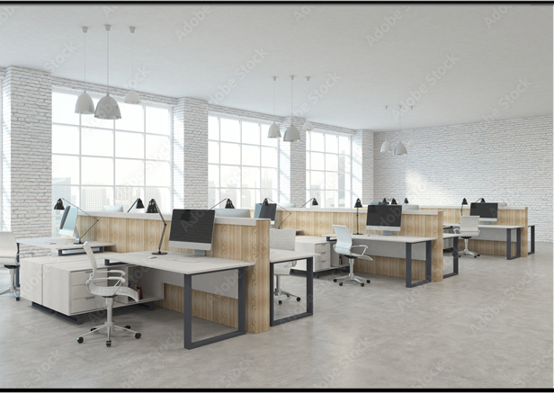 Open-plan office with rows of light-wood workstations